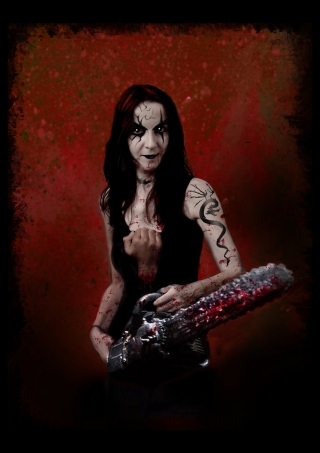 tattooed girl with bloody chainsaw