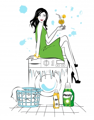 Young happy woman sitting on the washing machine and drinking orange juice