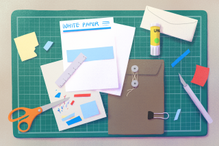 stationary, paper, envelope, scissor, glue, post-its on cutting board