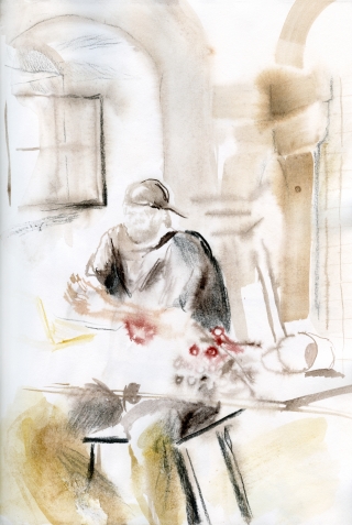 man in studio sitting at the working table