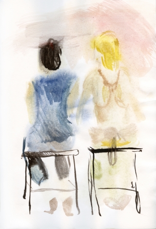 two girls having a talk sitting on chairs with the back at the viewer