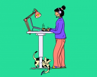 A woman is working at home on a standing desk..jpg