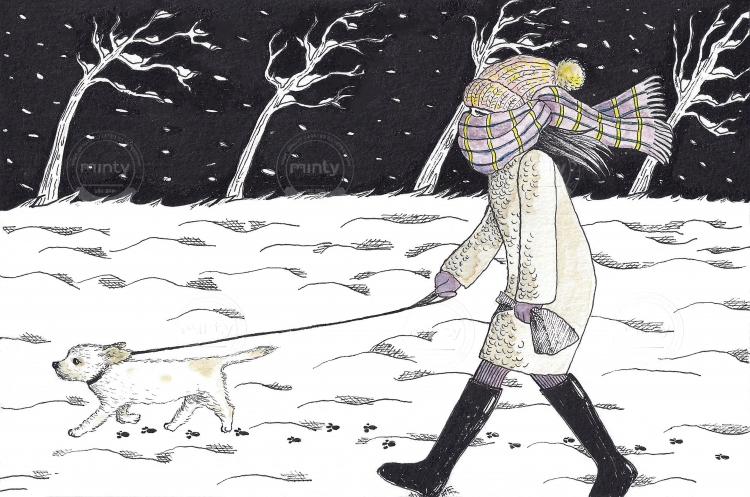 Woman walking her dog in a cold winter night