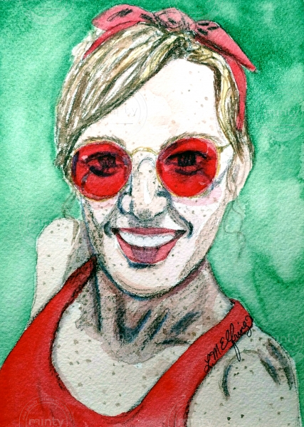 Portrait of a freckled girl with red sunglasses.