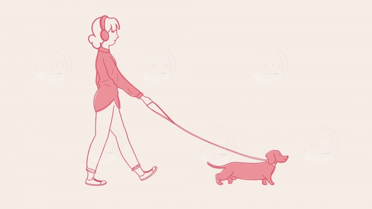Girl walking dog while listening to music